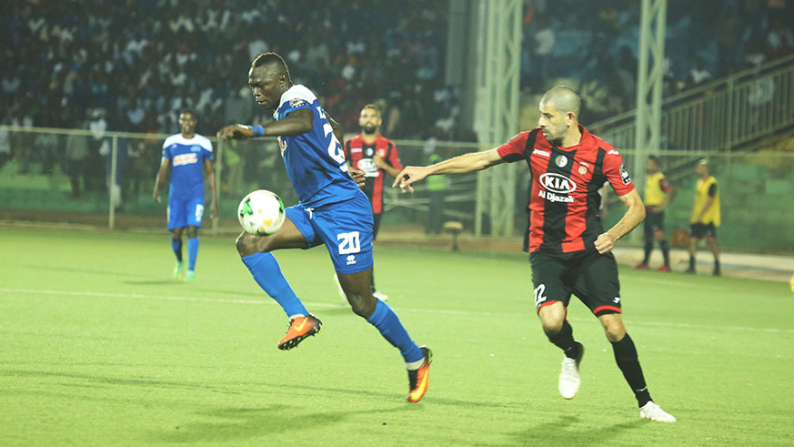 Rayon Sports forward Ismailla Diarra goes past  USM Alger defender Mohamed Meftah