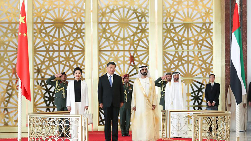 Chinese President Xi Jinping, his wife Peng Liyuan and the United Arab Emirates (UAE) Vice President and Prime Minister Sheikh Mohammed bin Rashid Al Maktoum are seen on a reviewing stand in Abu Dhabi, the UAE, July 19, 2018. Xi arrived here on Thursday for a state visit to the UAE. The UAE's vice president hosted a welcome ceremony for the Chinese president at the airport. (Xinhua/Xie Huanchi)