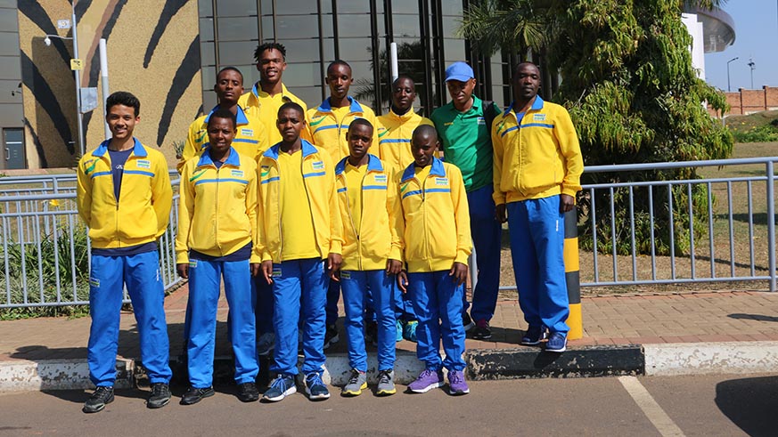 Karate and athletics youth players and technical staff pose for a group photo at Kigali International Airport shortly before their departure yesterday. Damas Sikubwabo