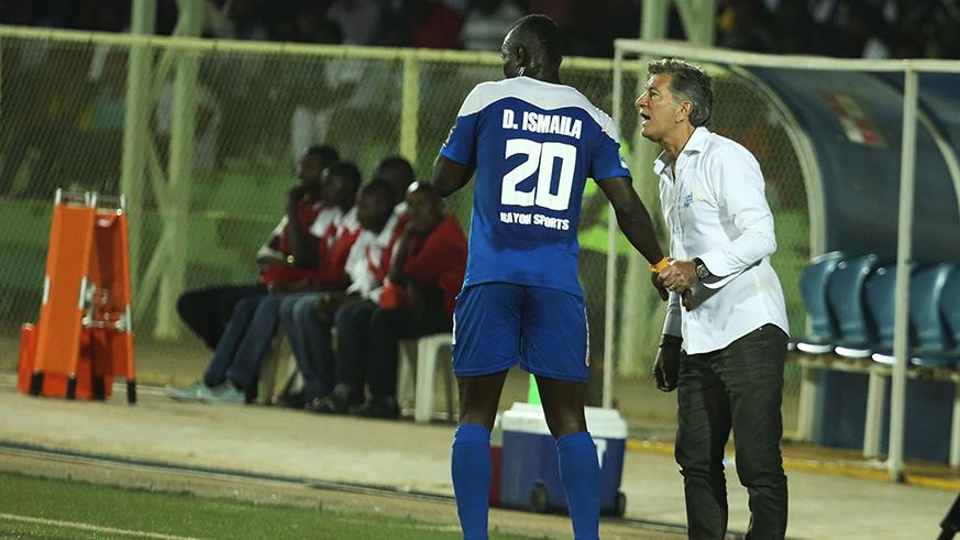 Rayon Sports goal scorer Ismailla Diarra with his coach Roberto Oliveira Goncalves do Carmo  during the match.  Sam Ngendahimana.