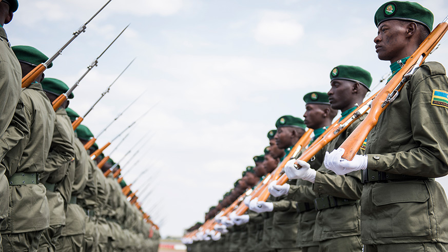 A guard of honour mounted by Rwanda Defence Force troops to welcome President Nyusi at Kigali International Airport, yesterday. Village Urugwiro.
