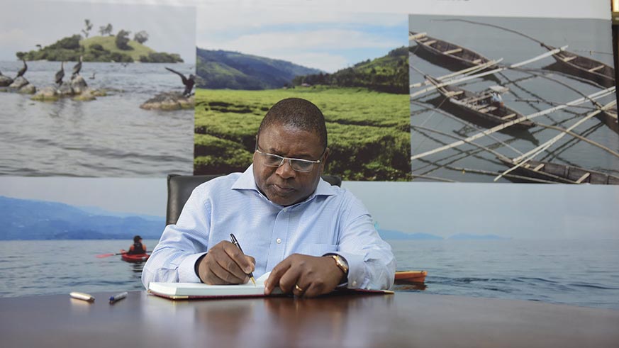Mozambique President Filipe Nyusi signs the guest book in Rubavu yesterday. Courtesy.