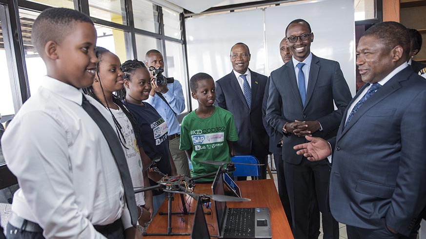 President Filipe Nyusi enjoys a light moment with young innovators at Telecom House on Friday. Courtesy.