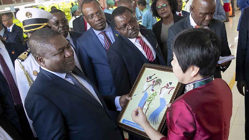 President Nyusi receives a gift from C&H Garments Rwanda management.  Courtesy.