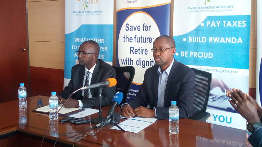 Pascal Ruganintwali, Deputy Commissioner General of RRA (right), and RSSB Director General Jonathan Gatera, during the launch of unified declaration for PAYE, Pension & Occupational Hazards, and Medical & Maternity leave.