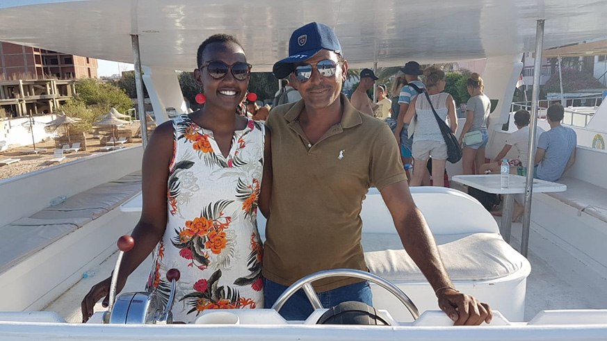 The writer (left) with one of the boat crew during a cruise. Courtesy.