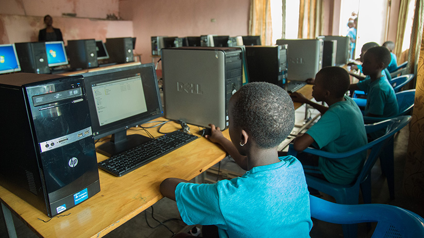 Students use computers during a computer lesson. Nadege Imbabazi. 