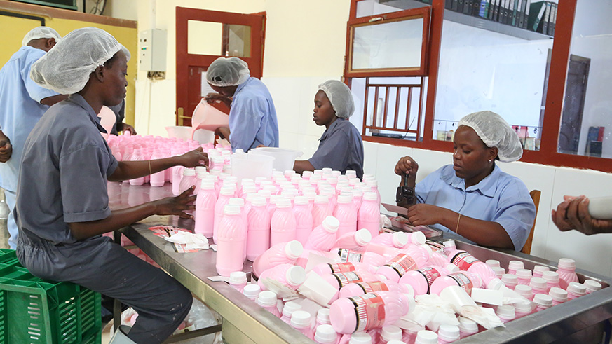 Workers at the Masaka Milk Plant at the Special Economic Zone. Such enterprises have been urged to consider fostering partnerships to increase trade volumes and have impact across the region. Sam Ngendahimana.