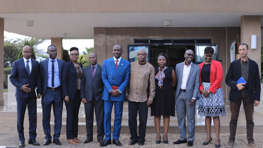 The AU delegation, led by Guy Cyrille Tapoko, Head Democracy and Electoral Assistance Unit (5th left), pose with Prof. Kalisa Mbanda, NEC Chairperson (6th left) and NEC Executive Secretary Charles Munyaneza (4th left) in Kigali yesterday. Emmanuel Kwizera.