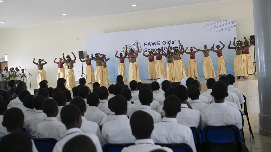 FAWE students perform a traditional dance to welcome the First Ladies to their school on Monday. Courtesy.