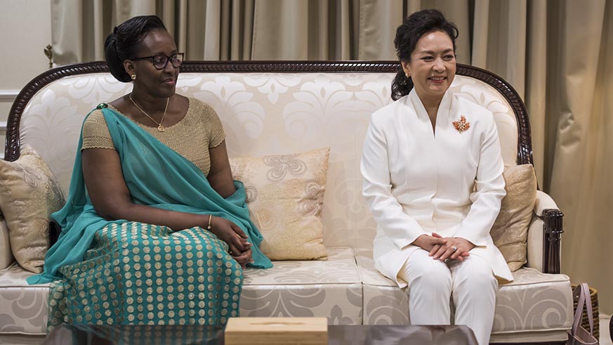 First Ladies Jeannette Kagame and Peng Liyuan moments after the Chinese First Couple arrived at Kigali International Airport on Sunday. Village Urugwiro.