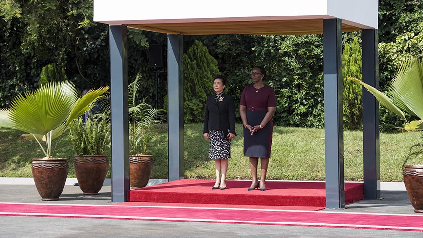 First Ladies Jeannette Kagame and Peng Liyuan at the welcome ceremony at Village Urugwiro on Monday. Village Urugwiro.