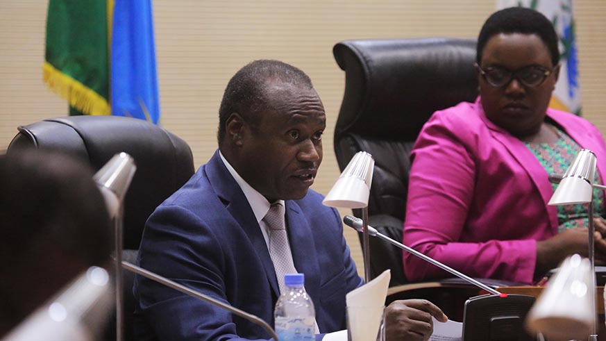 Minister of Finance and Economic Planning Dr Uzziel Ndagijimana addresses the parliament on Mutuelle de Sante yesterday (Sam Ngendahimana)