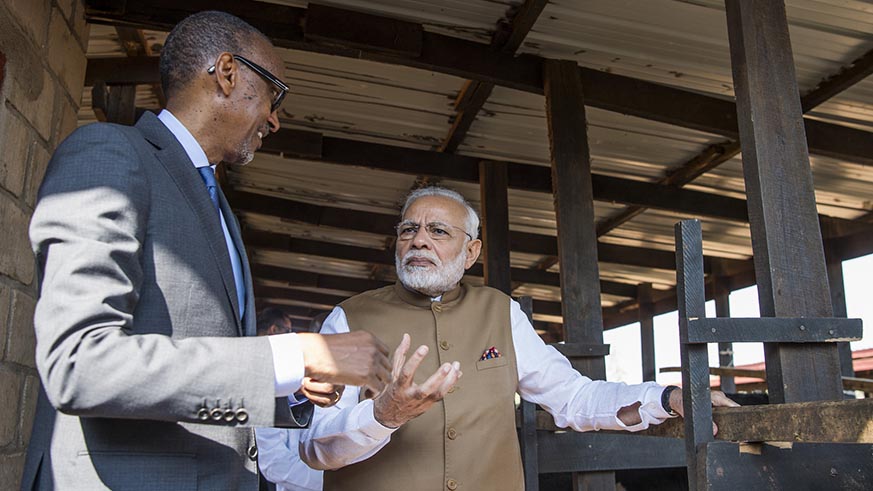 President Paul Kagame and Prime Minister Narendra Modi chat in Rweru model village in Bugesera, on Tuesday, where the Indian leader donated 200 cows to vulnerable residents in the area, which he said was a donation toward President Kagameâ€™s Girinka programme. Village Urugwiro.