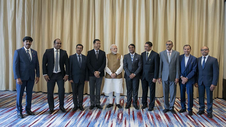 Prime Minister Narendra Modi poses with Indian business leaders in Kigali on Tuesday. Village Urugwiro.