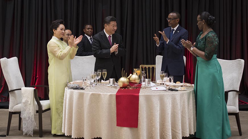 The two Presidents and First Ladies clap after sharing a toast at Kigali Convention Centre on Monday. Village Urugwiro.