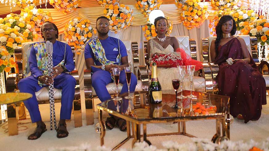 Singer Safi Madiba and Judith Niyonizera on their giveaway ceremony in Kigali, with their best man and maid of honour in 2017. Courtesy.