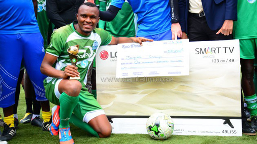 Tuyisenge poses with his trophy and other prizes. Net photo.