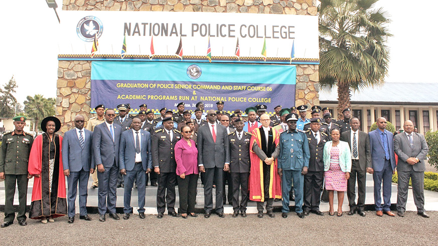 Officers who completed the sixth intake of  Police Senior Command and Staff Course pose for a group photo with officials who witnessed the graduation ceremony. Regis Umurengezi. 