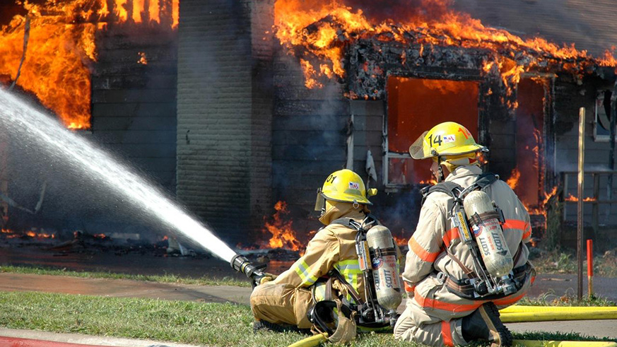 Firefighters battling a structure fire at a  story building. Net. 