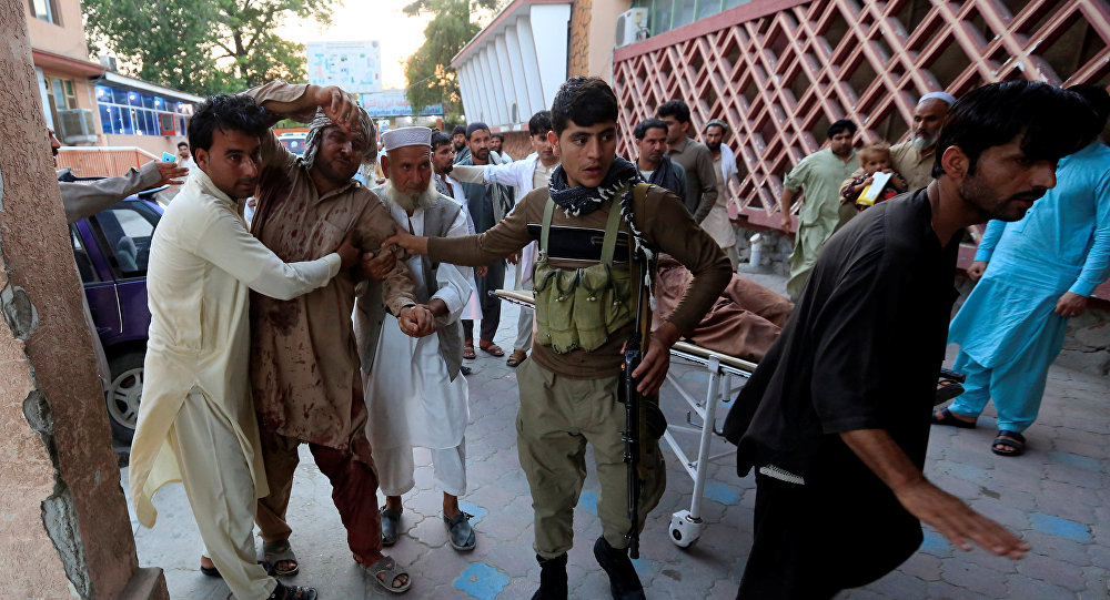 Men carry an injured man in a hospital after a suicide attack in Jalalabad, Afghanistan July 30, 2018. / Sputnik