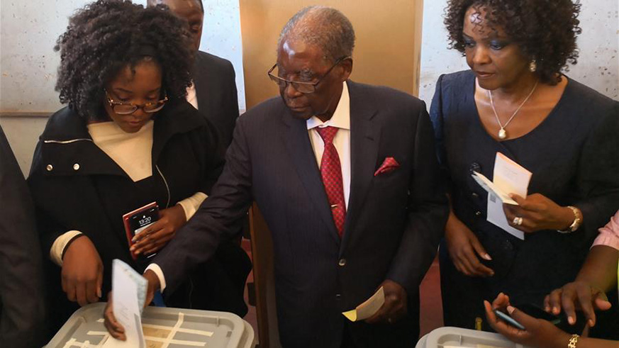 Former Zimbabwean president Robert Mugabe (C) votes in Highfield, Harare, Zimbabwe, July 30, 2018. Zimbabweans began voting on Monday in the African country's first presidential election since former head of state Robert Mugabe resigned in November. (Xinhua/Zhang Yuliang)