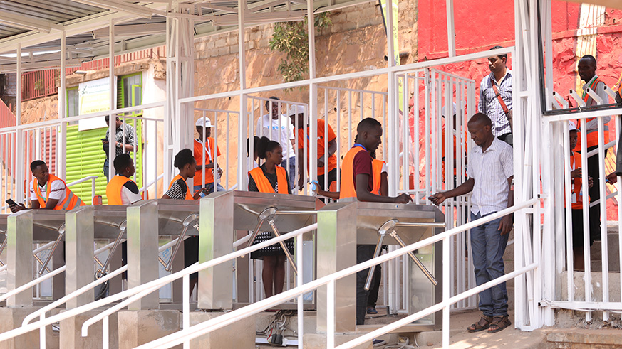 A man uses u2018tap-and-gou2019 electronic payment card to access the Expo Grounds in Gikondo, the venue for the ongoing Rwanda International Trade Fair, yesterday.  Emmanuel Kwizera. 