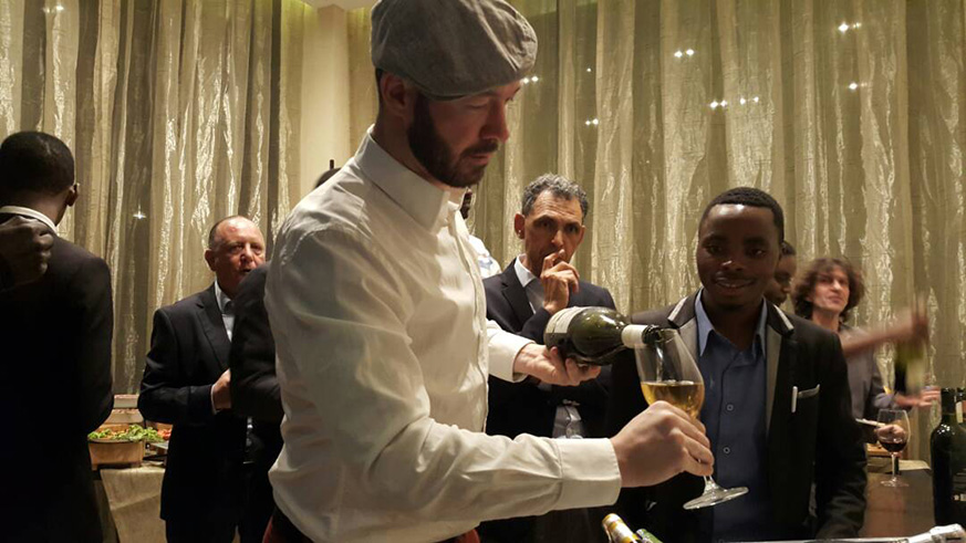 Wine expert Gil Cheviron serves a glass of wine  at the first edition of Wine Tasting at Kigali Marriott Hotel in February, this year.