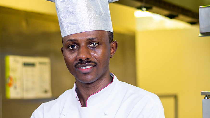 Wine expert Gil Cheviron serves a glass of wine  at the first edition of Wine Tasting at Kigali Marriott Hotel in February, this year.