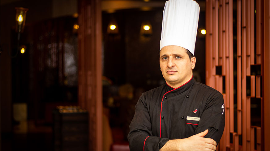 Wine expert Gil Cheviron serves a glass of wine  at the first edition of Wine Tasting at Kigali Marriott Hotel in February, this year.