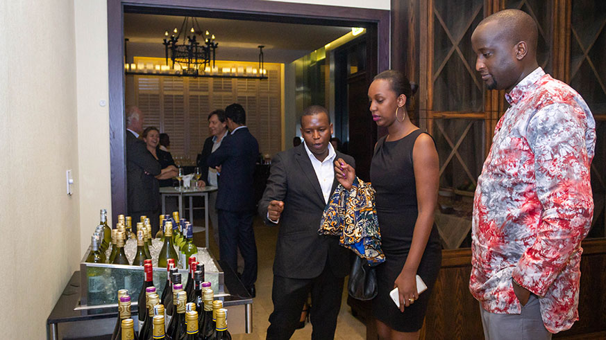 Wine expert Gil Cheviron serves a glass of wine  at the first edition of Wine Tasting at Kigali Marriott Hotel in February, this year.