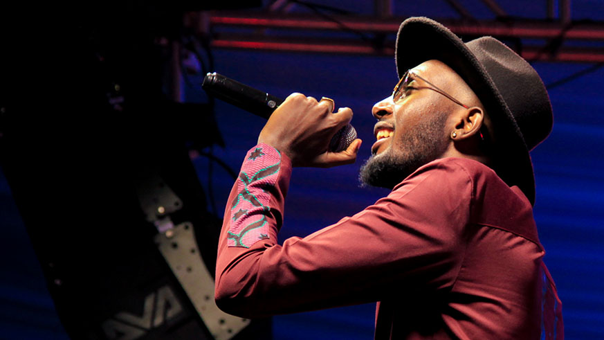 DJ Pius singing during the launch of his first album on last Friday. (Faustin Niyigena)