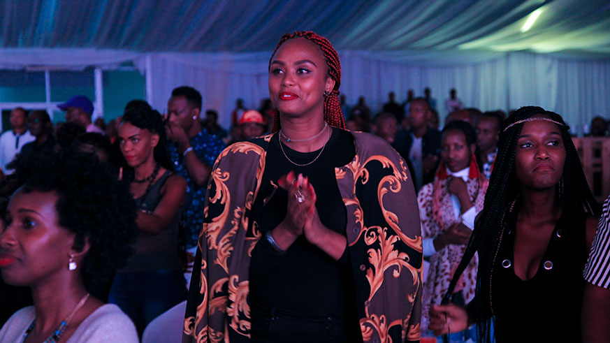 DJ Pius' wife Ange during the concert. (DJ Pius singing during the launch of his first album on last Friday. (Faustin Niyigena)