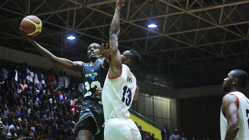 Forward Steven Havugintwari (with the ball) contributed 10 points, 9 rebounds and 6 assists in Patriots 74-71 victory on Friday. REGu2019s Elie Kaje (#13) posted a game high 24 points. Sam Ngendahimana.