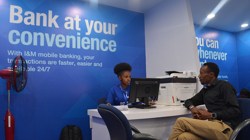 I&M Bank Expo branch helps new clients open their account.