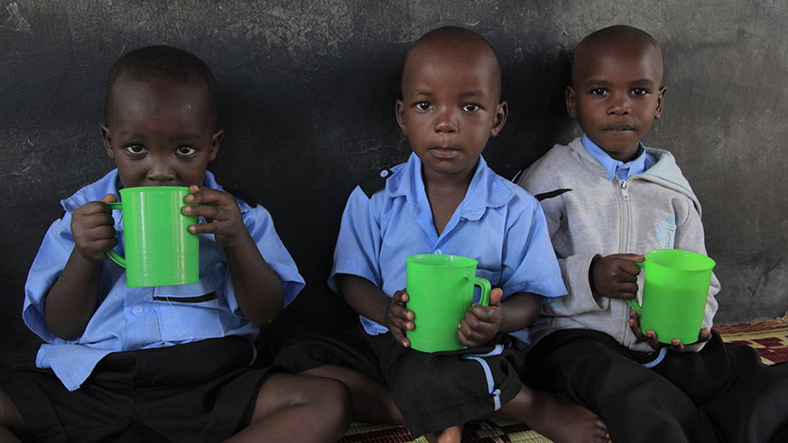 Children eat porridge at  Mageragere Early Childhood Development Centre in Nyarugenge District. Sam Ngendahimana.