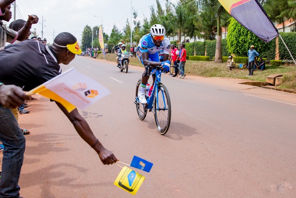 Cycling fans in Rwamagana cheer on Valens Ndayisenga in a solo escape ahead of the peloton during the fourth lap yesterday. The 24-year old finished fifth, 12 seconds adrift of stage winner Azzedine Lagab of Algeria. Courtesy