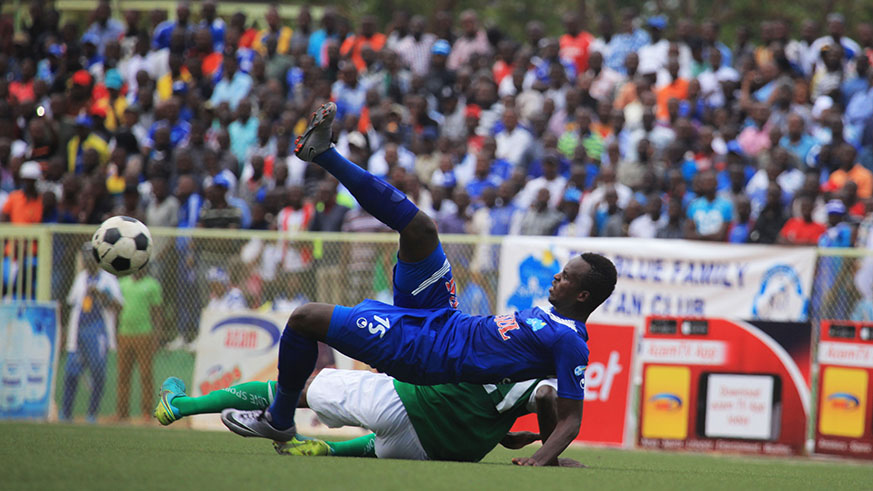 Former Rayon Sports defender Faustin Usengimana vies for the ball with former Kiyovu SC captain Fabrice Kakure Mugheni during a past league match. Usengimana, 24, penned a 2-year deal with the Kuwaiti side on Saturday. Sam Ngendahimana.