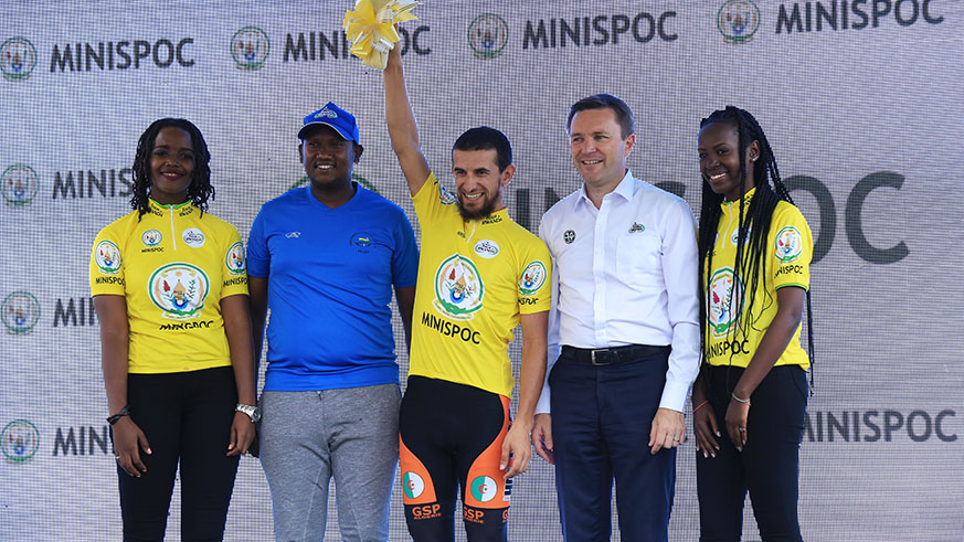 The president of the International Cycling Union (UCI), David Lappartient poses with yellow jersey holder Ladab Azzedine after winning stage 1 in Rwamagana yesterday
