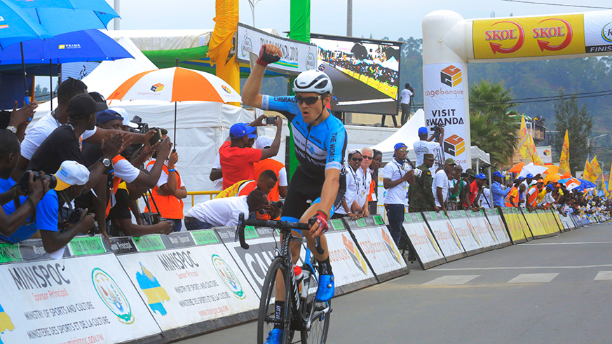 Stage winner  Julian Hellmann, of Team Embrace the World, celebrates his victory after crossing the finish-line in Musanze District yesterday. Sam Ngendahimana.