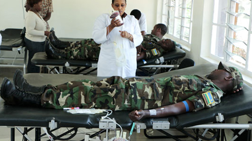 Soldiers from Kanombe military barracks in a past blood donation exercise. File photo.
