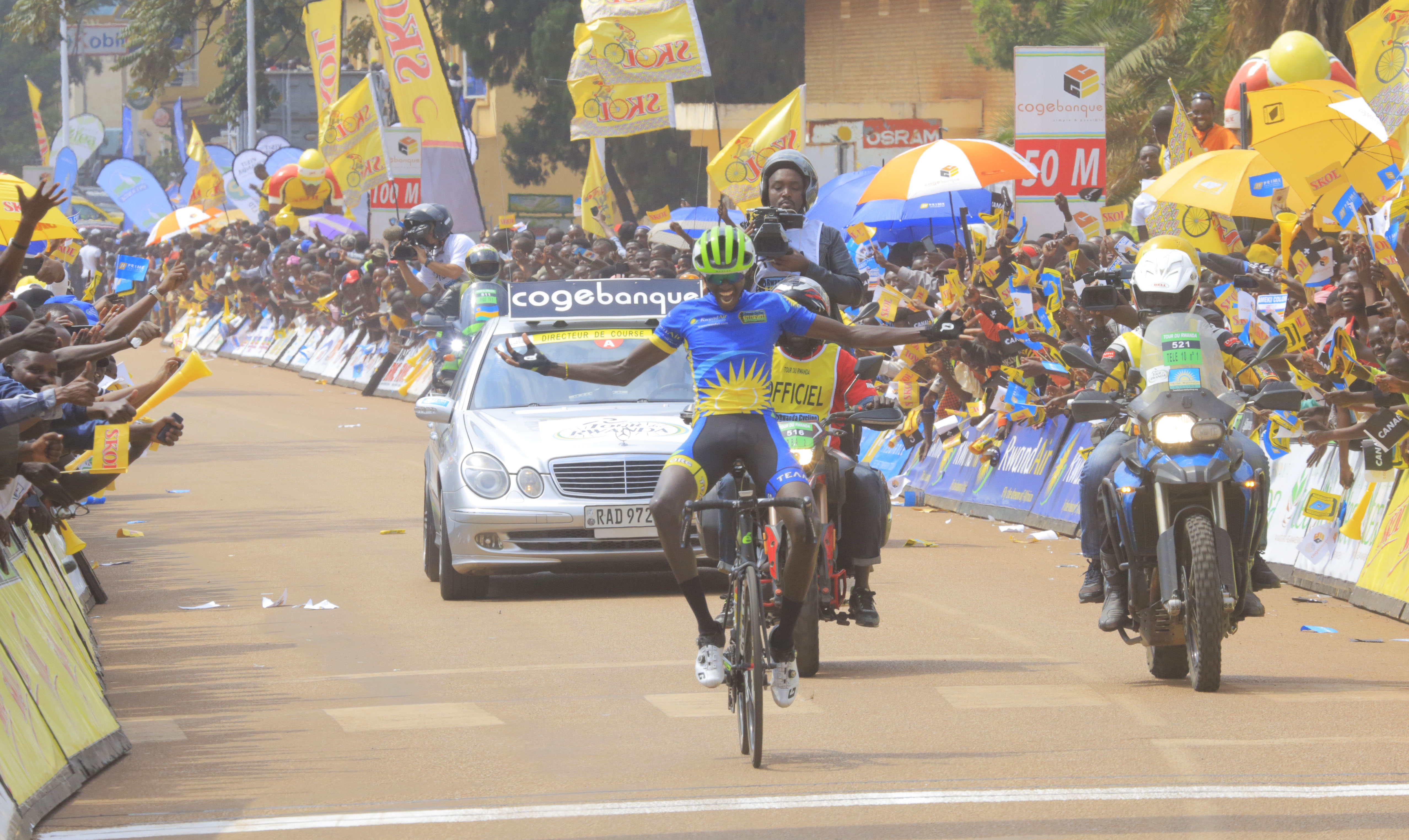 Stage 2 winner Samuel Mugisha celebrates his solo finish as he crosses the finish-line in Huye town yesterday. Sam Ngendahimana