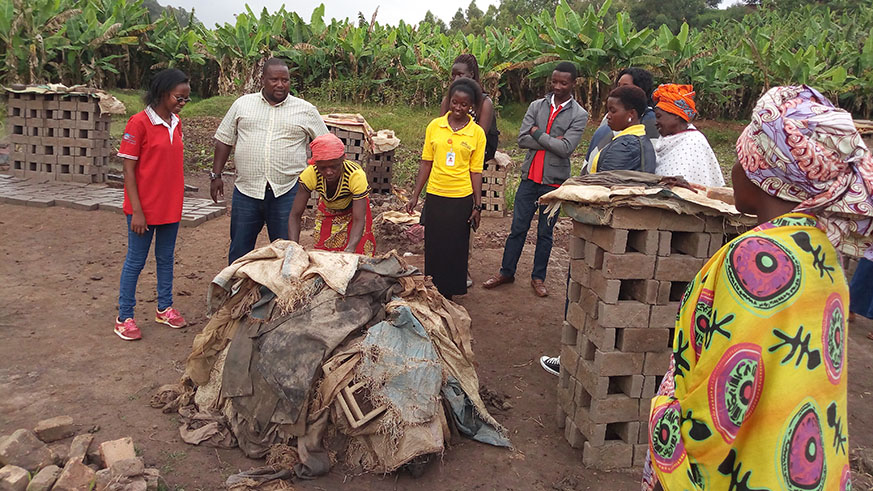 Muramira(second left) on feild with some of the beneficiaries