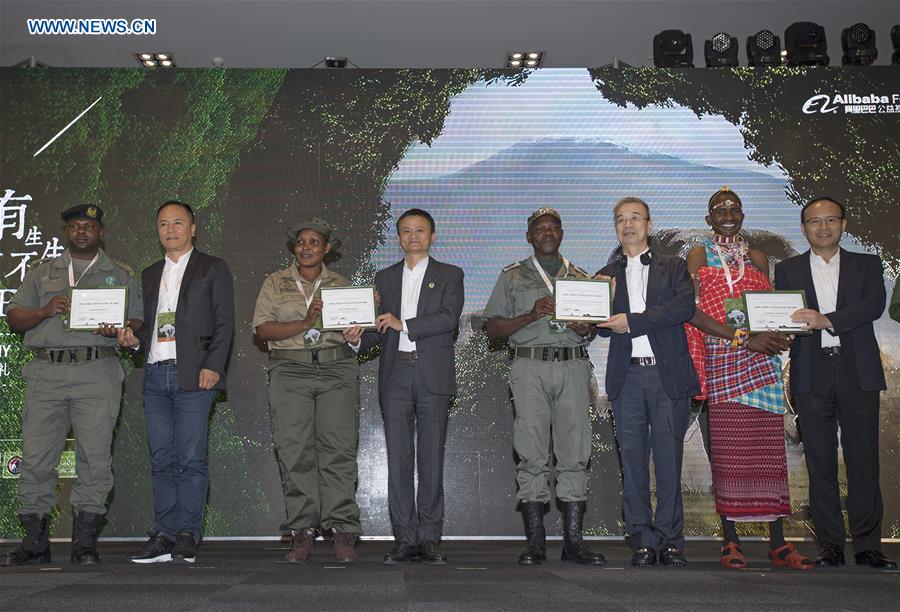 Jack Ma (4th L), Executive Chair of Alibaba Group and Co-chair of the Paradise Foundation presents an award to an African ranger during the 2018 Ranger Awards ceremony in Cape Town, South Africa, on Aug. 7, 2018. The African Ranger Awards was launched by the Alibaba Foundation together with the Paradise Foundation in July this year. Under the initiative that will last 10 years, 50 wildlife rangers will be awarded each year, with a prize of 3,000 U.S. dollars each. (Xinhua/Chen Cheng)