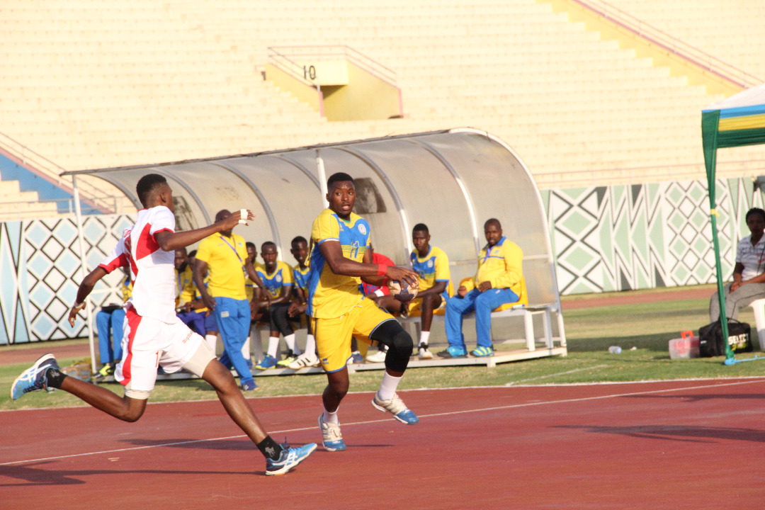 Rwanda's Fidele Hagenimana tries to round off a Senegalese defender for a goal during the 33-31 defeat in Group B opener at Amahoro stadium yesterday. (Damas Sikubwabo)