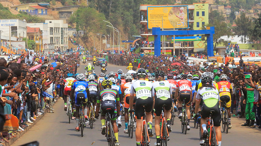 Thousands of cycling spectators lined up on the roadside in Nyabugogo as they cheered on riders during Stage 2 from Kigali to Huye on Monday. Sam Ngendahimana.