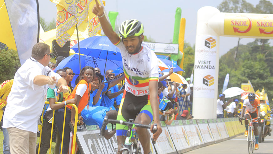 Ethiopian Desalegn Temalew celebrates after edging Rwandau2019s Moise Mugisha to the finish line to register his first stage victory in this yearu2019s Tour du Rwanda in Kinigi, Musanze District yesterday. Sam Ngendahimana.