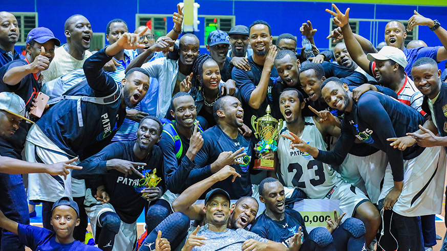 Patriots players joined by club officials and supports celebrate after beating rivals Rwanda Energy Group (REG) to retain the playoffs title at Amahoro Indoor Stadium on Friday night. Emmanuel Kwizera.