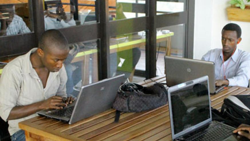 IT enthusiasts at work at K Lab at Telecom House, Kacyiru. File.