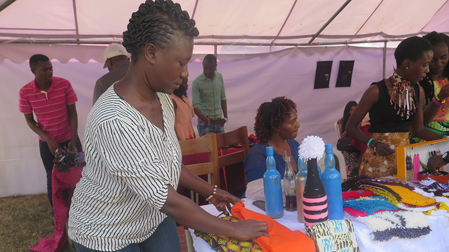 An exhibitor displays a tissue holder on her stand. Eddie Nsabimana